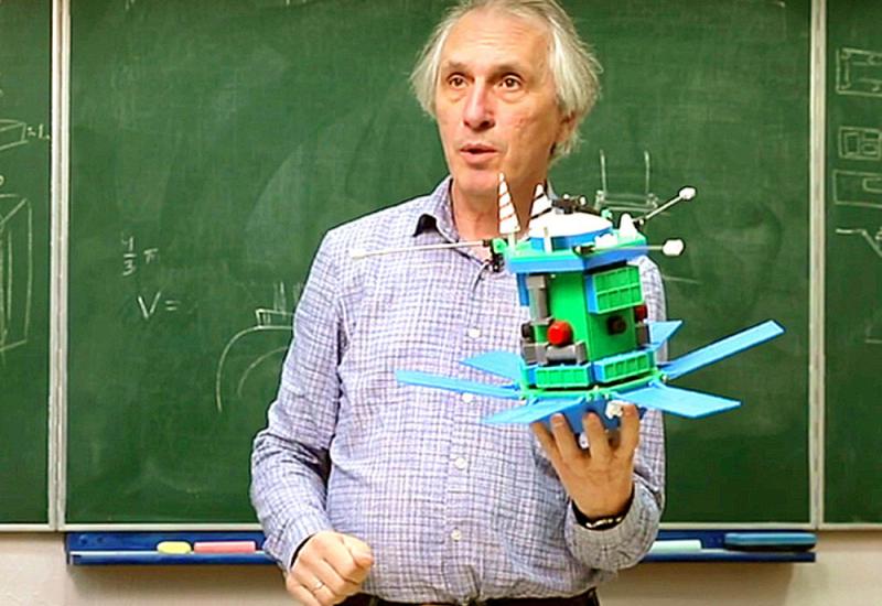 S. Pukha demonstrates the model of the microsatellite